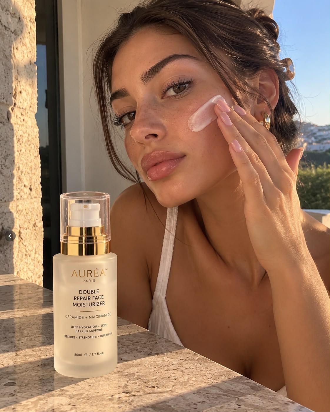 Applying AURÉA Double Repair Moisturizer